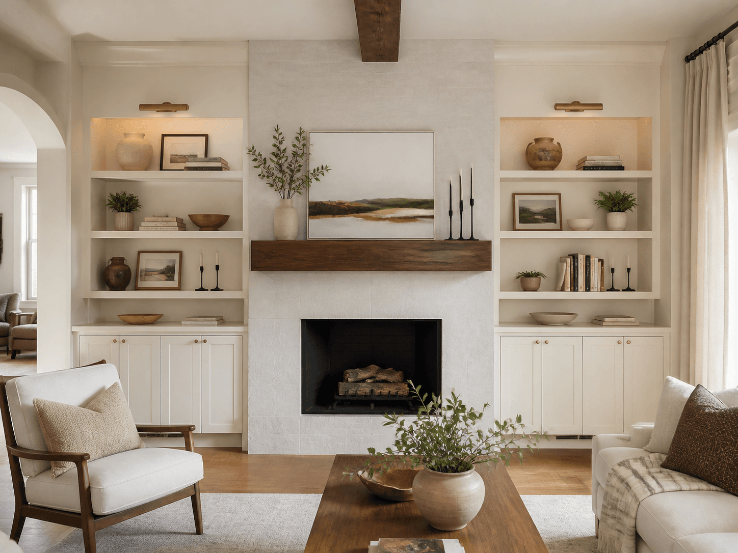 Remodeled fireplace with walnut mantel and warm white built-ins